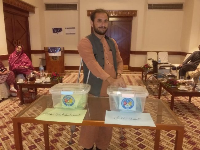 A voter casts his vote in election of provincial representatives for National CIP at Quetta-Balochistan