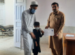 A child with a disability receives his disability certificate.